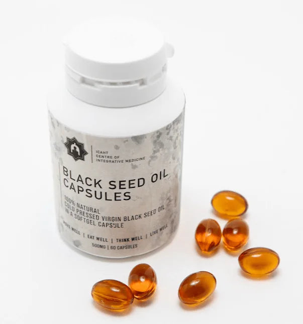 Black seed oil capsules with a container on a white background