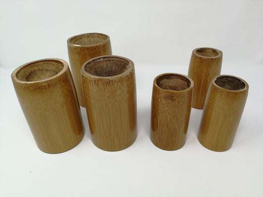 Set of six bamboo cups on a white background