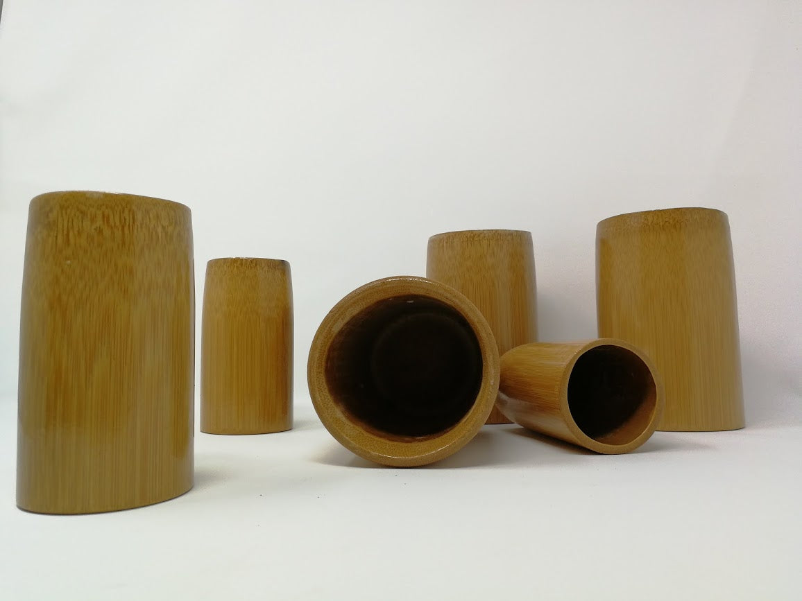 Set of bamboo cups on a white background