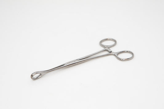 Metallic forceps on a white background