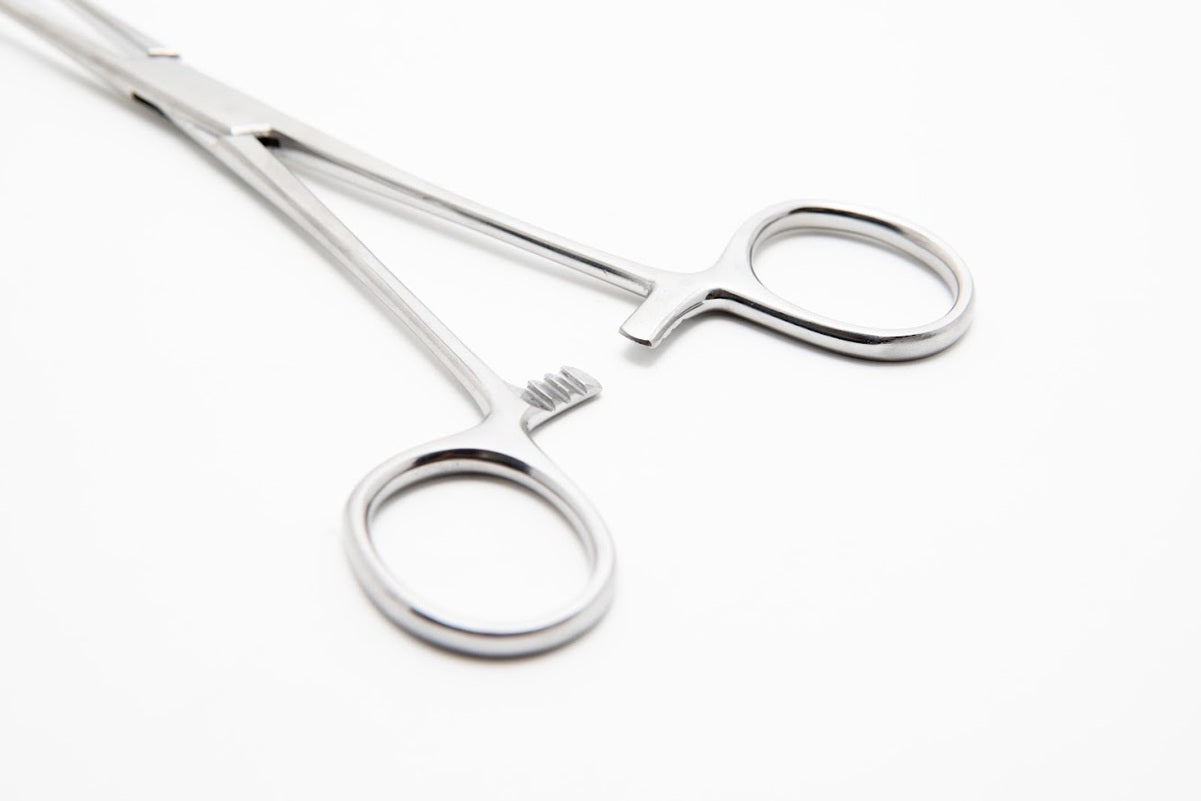 Metallic scissors on a white background