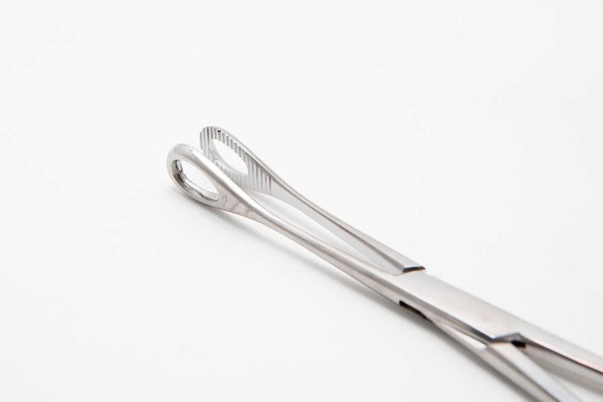Metal tongs on a white background