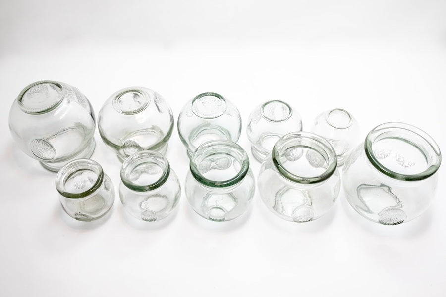Set of clear glass jars on a white background