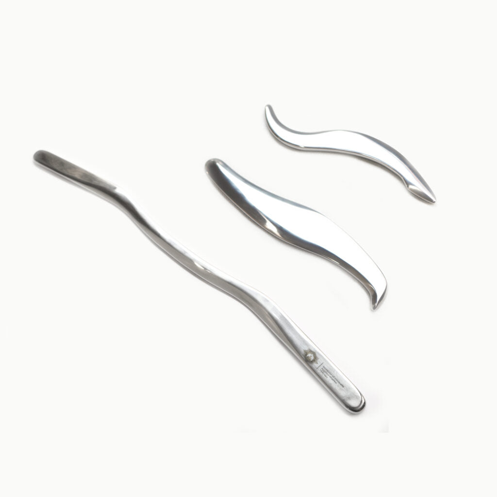 Two metal hair curling irons on a white background