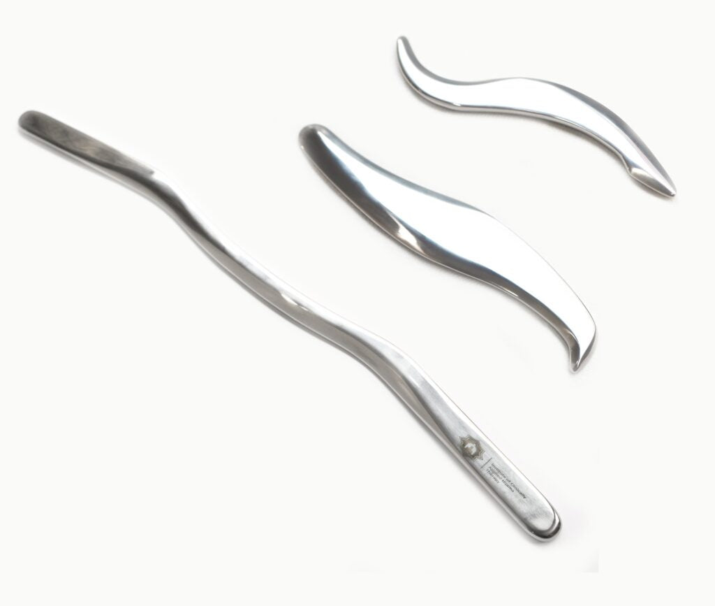 Set of metal tweezers on a white background