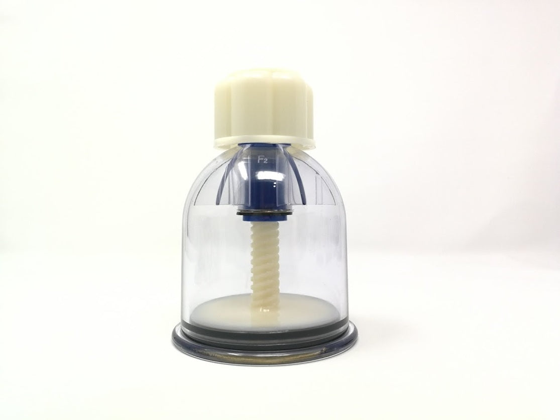 Clear glass container with a white lid and black base on a white background