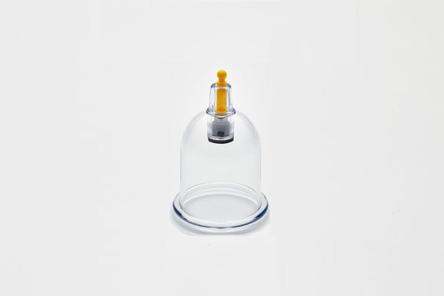 Glass cupping device on a white background