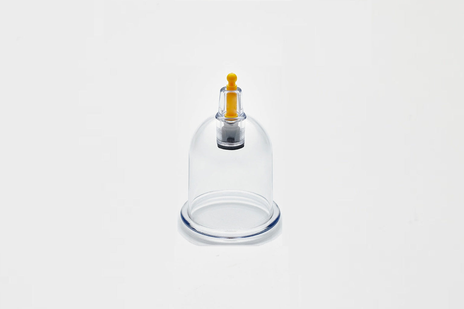 Glass cupping device on a white background