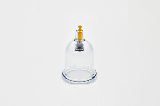 Glass cupping device on a white background
