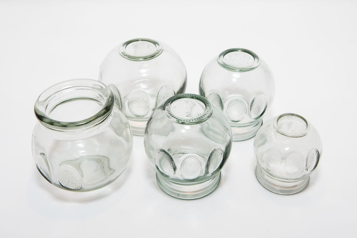 Set of clear glass jars on a white background