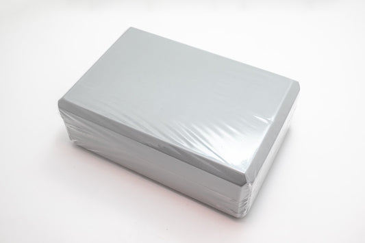 yoga block in grey in white background